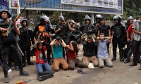 Egyptian security forces arrest supporters of ousted president Mohamed Morsi at Nahda Square in Cairo